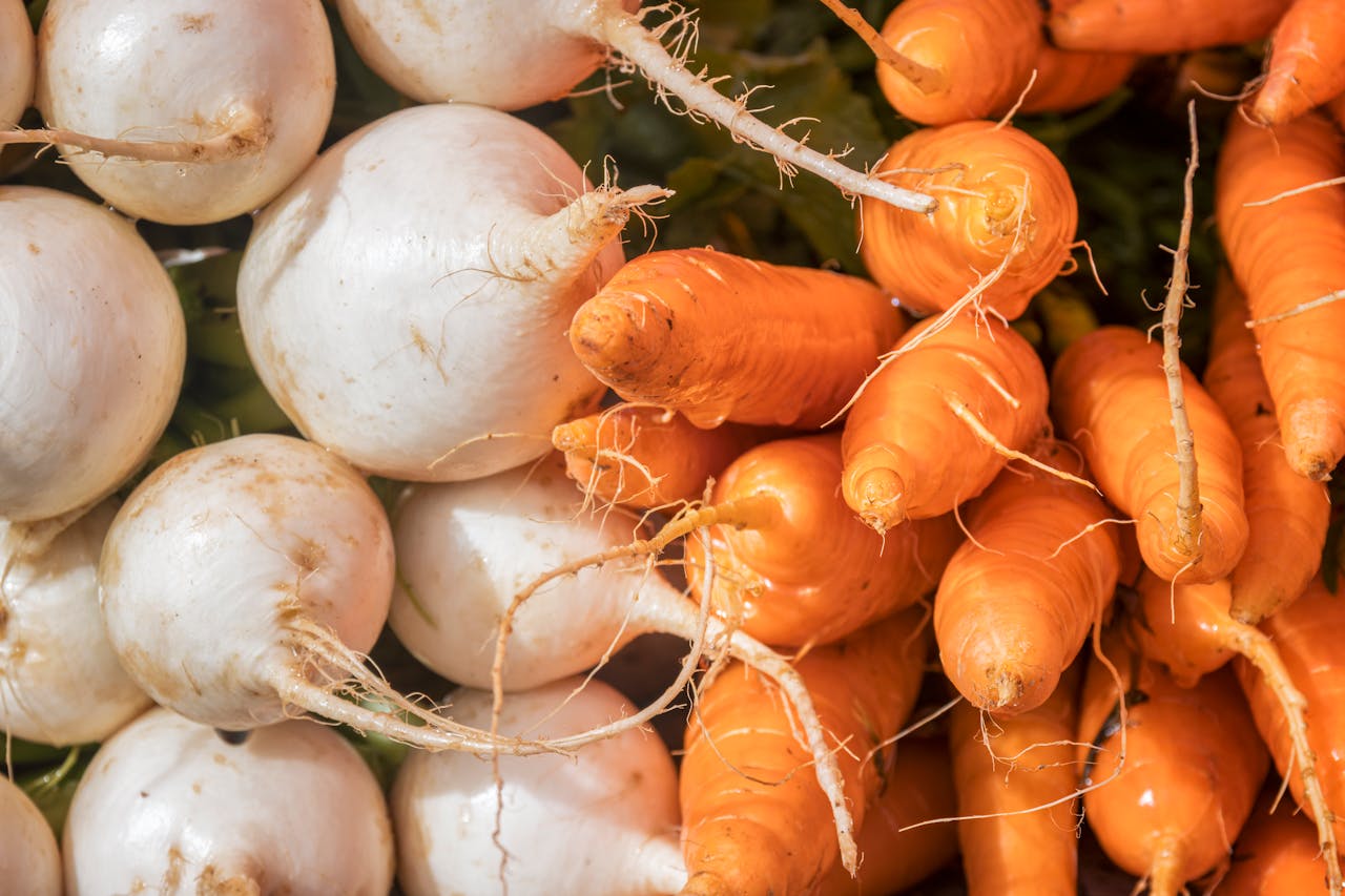 Mastering the First Impression: Your intriguing post title goes here Close-up of vibrant carrots and turnips at a local market, showcasing freshness.